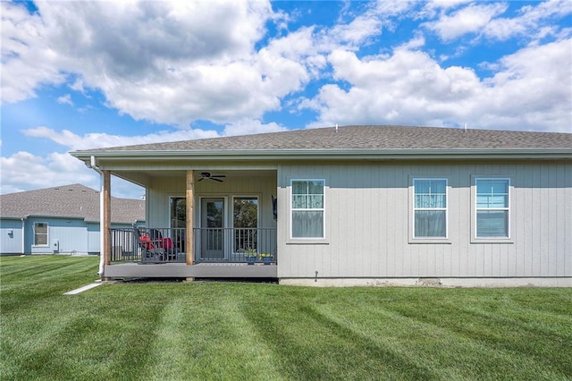 24129 W 95th St, Lenexa, KS 66227 - rear view of house with ceiling fan, a lawn, and roof with shingles