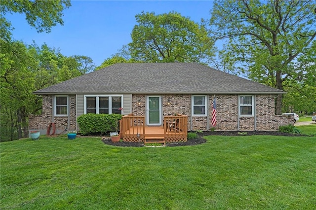 6525 County Line Rd, Shawnee, KS 66216 - rear view of property with a wooden deck, a lawn, roof with shingles, and brick siding