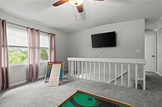 6525 County Line Rd, Shawnee, KS 66216 - recreation room featuring carpet flooring, ceiling fan, and a textured ceiling