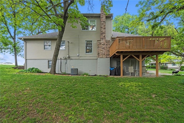 6525 County Line Rd, Shawnee, KS 66216 - rear view of property featuring a wooden deck, a yard, a chimney, and a patio area