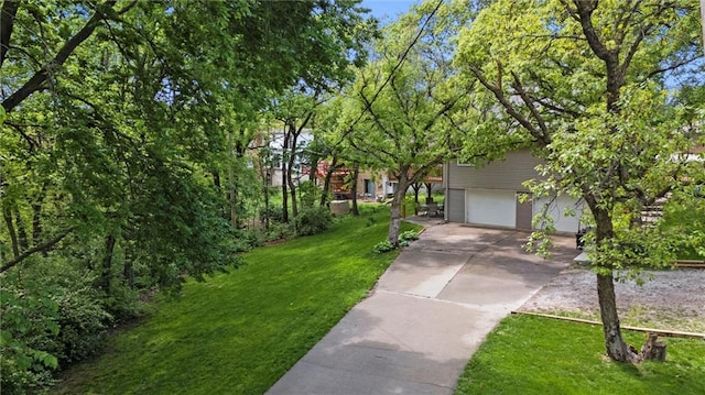 6525 County Line Rd, Shawnee, KS 66216 - view of front of home with concrete driveway, a front yard, and a garage