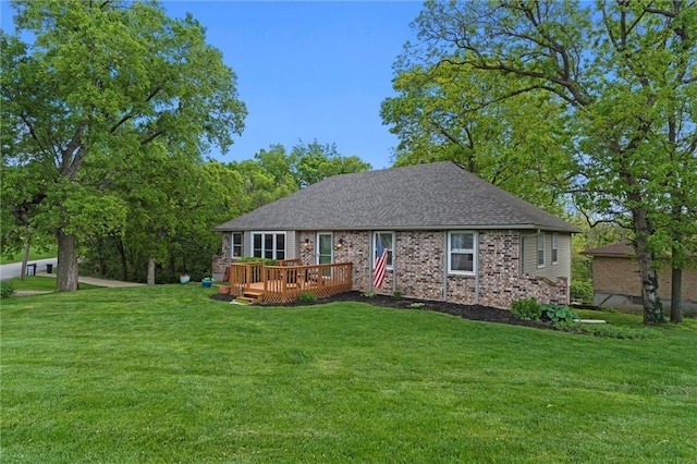 6525 County Line Rd, Shawnee, KS 66216 - view of front of property featuring a front lawn, a wooden deck, brick siding, and a shingled roof