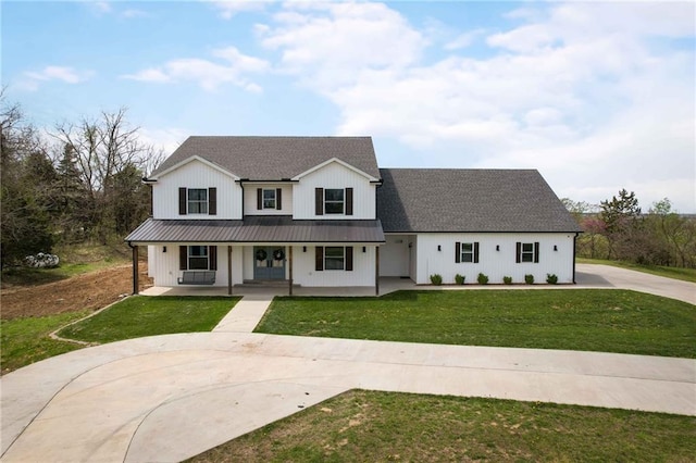 24905 W 57th St, Shawnee, KS 66226 - modern inspired farmhouse featuring concrete driveway, a porch, a front lawn, metal roof, and cooling unit