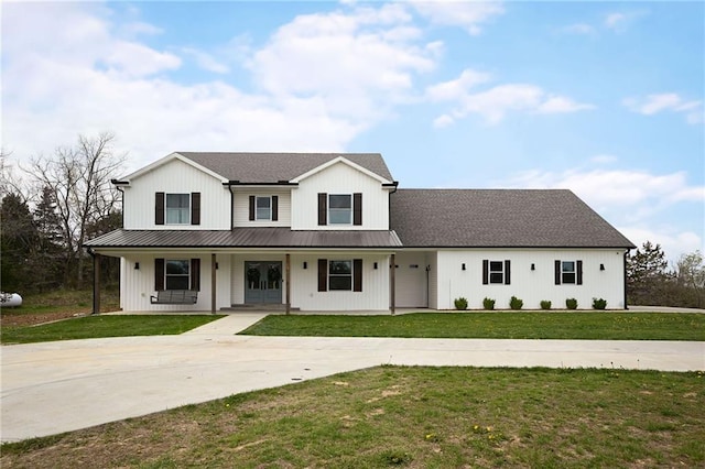 24905 W 57th St, Shawnee, KS 66226 - modern farmhouse style home featuring driveway, a porch, a front yard, and metal roof