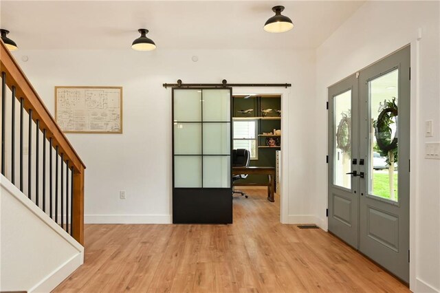 24905 W 57th St, Shawnee, KS 66226 - entrance foyer with french doors, light wood-style flooring, stairs, and baseboards