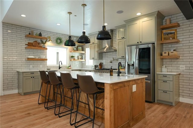 24905 W 57th St, Shawnee, KS 66226 - kitchen with open shelves, stainless steel refrigerator with ice dispenser, light wood-type flooring, a sink, and light countertops