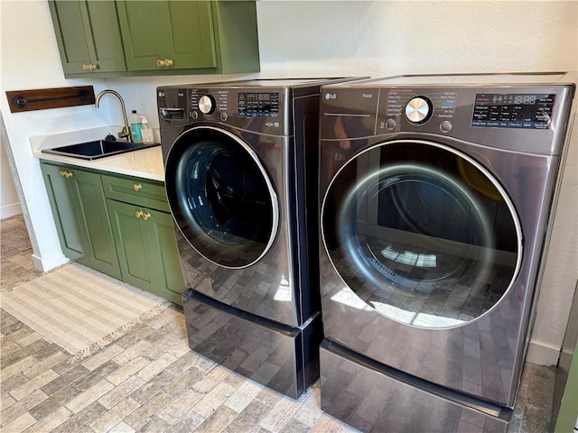 24905 W 57th St, Shawnee, KS 66226 - washroom with washing machine and clothes dryer, cabinet space, and baseboards