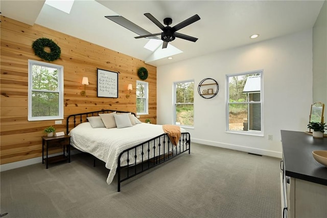 24905 W 57th St, Shawnee, KS 66226 - bedroom featuring wooden walls, baseboards, carpet flooring, a skylight, and recessed lighting
