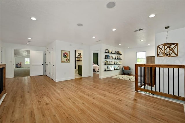 24905 W 57th St, Shawnee, KS 66226 - unfurnished living room with recessed lighting, light wood finished floors, and baseboards