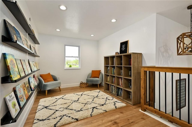 24905 W 57th St, Shawnee, KS 66226 - sitting room featuring wood finished floors, baseboards, and recessed lighting