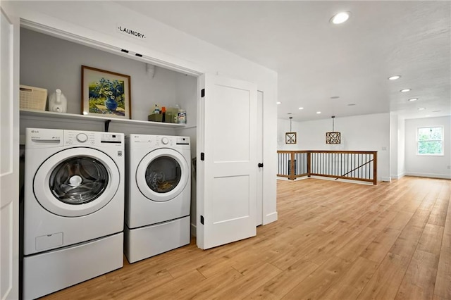 24905 W 57th St, Shawnee, KS 66226 - laundry room with washing machine and clothes dryer, light wood-type flooring, recessed lighting, and baseboards