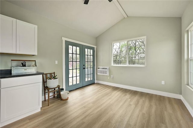 24905 W 57th St, Shawnee, KS 66226 - dining room featuring light wood-type flooring, french doors, healthy amount of natural light, and lofted ceiling