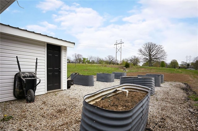24905 W 57th St, Shawnee, KS 66226 - view of grassy yard with a garden