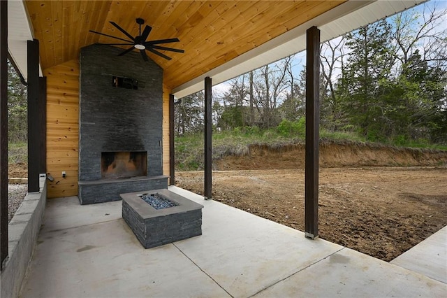24905 W 57th St, Shawnee, KS 66226 - view of patio / terrace with an outdoor stone fireplace and ceiling fan