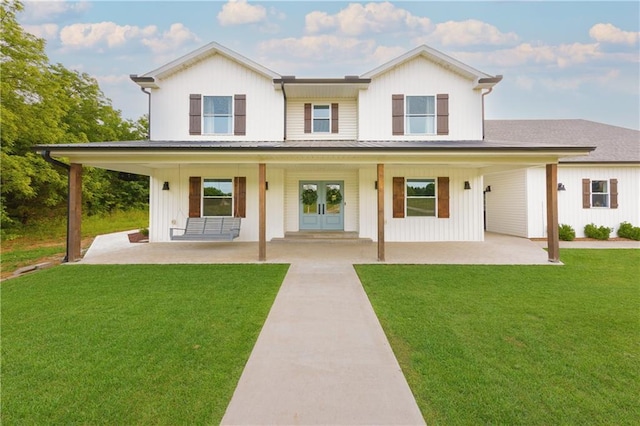 24905 W 57th St, Shawnee, KS 66226 - view of front of property featuring french doors, a front lawn, and a porch