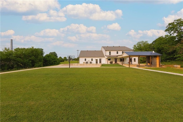 24905 W 57th St, Shawnee, KS 66226 - modern farmhouse style home with a front yard, a patio, and stucco siding