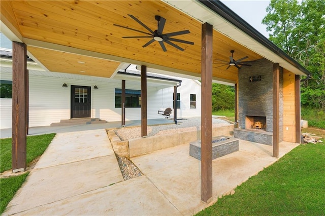 24905 W 57th St, Shawnee, KS 66226 - view of patio with an outdoor stone fireplace and ceiling fan