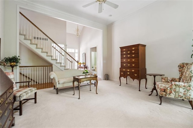 14913 W 72nd St, Shawnee, KS 66216 - carpeted living area with ceiling fan, ornamental molding, a chandelier, stairway, and a towering ceiling