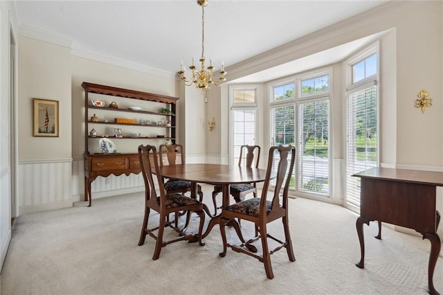 14913 W 72nd St, Shawnee, KS 66216 - dining area featuring crown molding, light carpet, and a chandelier