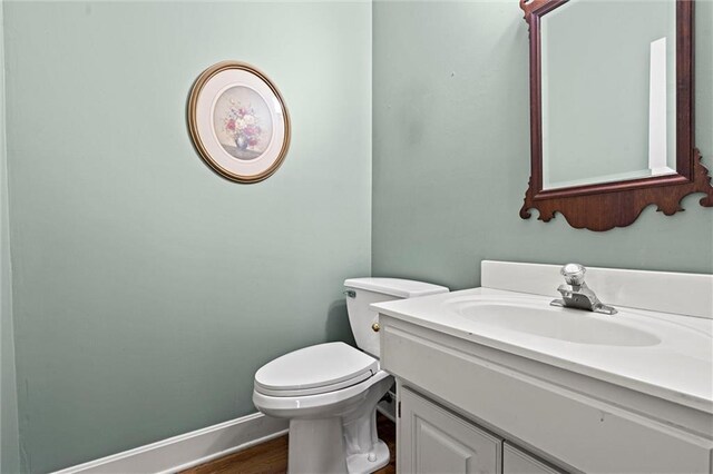 14913 W 72nd St, Shawnee, KS 66216 - half bathroom featuring vanity and wood finished floors