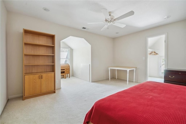 14913 W 72nd St, Shawnee, KS 66216 - bedroom with light colored carpet, ceiling fan, and arched walkways