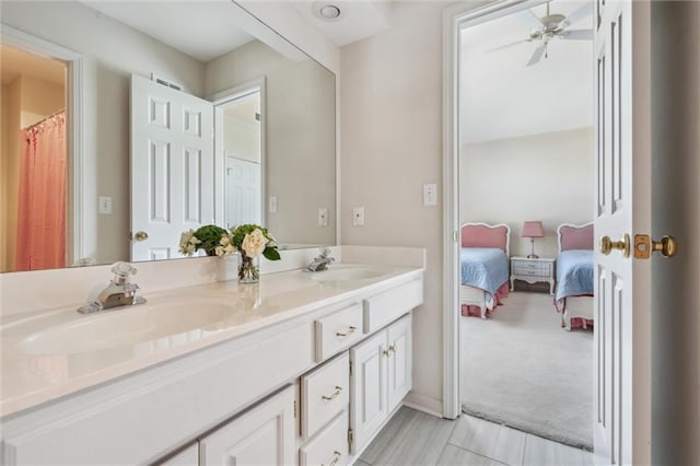 14913 W 72nd St, Shawnee, KS 66216 - full bath featuring double vanity, ensuite bath, and a ceiling fan