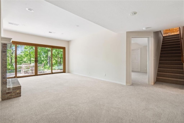 14913 W 72nd St, Shawnee, KS 66216 - unfurnished living room with light colored carpet, stairway, and recessed lighting