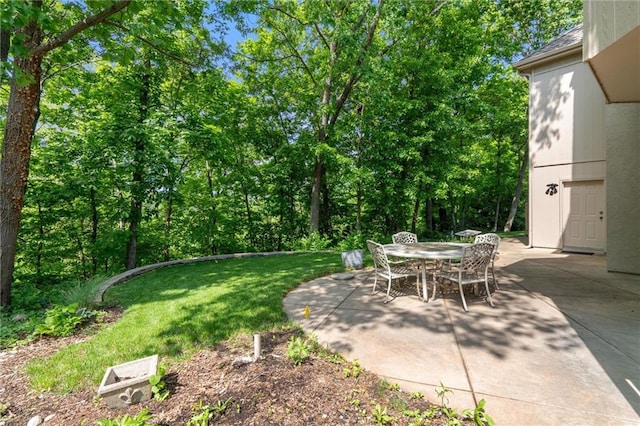 14913 W 72nd St, Shawnee, KS 66216 - view of grassy yard with a patio and outdoor dining space