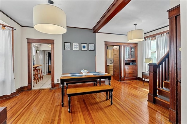 1405 W 40th St, Kansas City, MO 64111 - dining area featuring light wood finished floors and crown molding