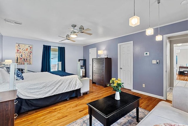 1405 W 40th St, Kansas City, MO 64111 - bedroom with wood finished floors, ceiling fan, and crown molding