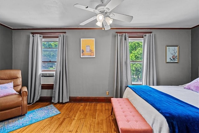 1405 W 40th St, Kansas City, MO 64111 - bedroom featuring multiple windows, light wood-type flooring, crown molding, ceiling fan, and cooling unit