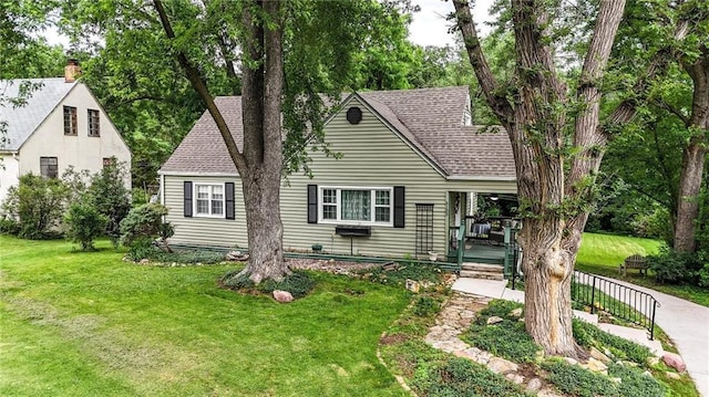5103 NE Marvin Rd, Kansas City, MO 64118 - view of front of house with a front lawn and roof with shingles