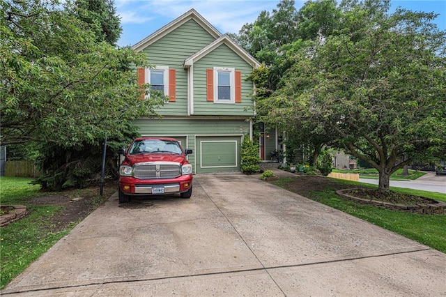 1515 Fox Run Ln, Raymore, MO 64083 - view of front of house with concrete driveway and a garage