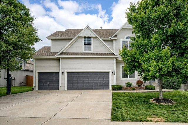 2208 SW Hawk View Rd, Lees Summit, MO 64082 - view of front facade with concrete driveway, a shingled roof, and an attached garage