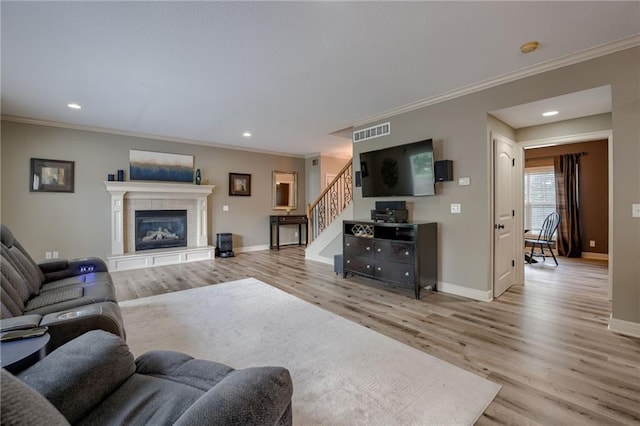 2208 SW Hawk View Rd, Lees Summit, MO 64082 - living room with wood finished floors, baseboards, stairs, crown molding, and recessed lighting