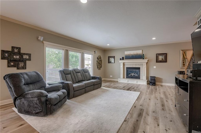 2208 SW Hawk View Rd, Lees Summit, MO 64082 - living area featuring light wood-style flooring, baseboards, ornamental molding, a fireplace, and recessed lighting