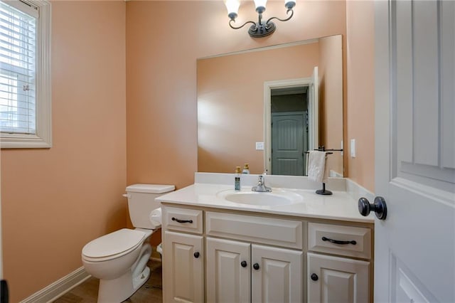 2208 SW Hawk View Rd, Lees Summit, MO 64082 - half bathroom with vanity, toilet, and baseboards
