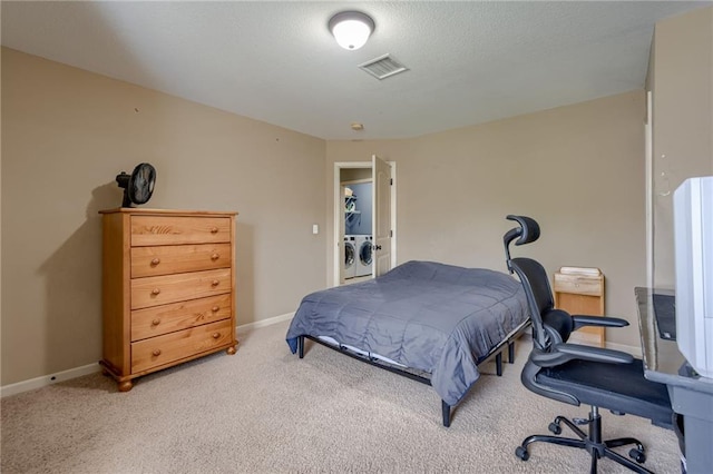 2208 SW Hawk View Rd, Lees Summit, MO 64082 - bedroom featuring washing machine and clothes dryer, light carpet, and baseboards