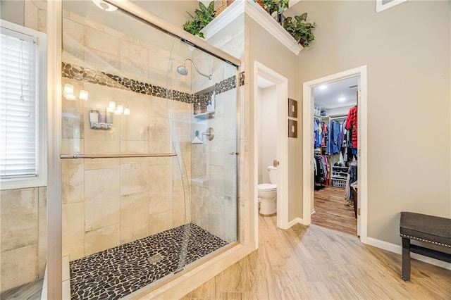 7905 W 129th St, Overland Park, KS 66213 - full bathroom featuring toilet, a stall shower, a spacious closet, and baseboards
