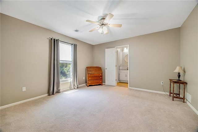 7905 W 129th St, Overland Park, KS 66213 - unfurnished bedroom featuring light colored carpet, baseboards, a ceiling fan, and ensuite bath