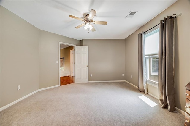 7905 W 129th St, Overland Park, KS 66213 - empty room with light colored carpet, ceiling fan, and baseboards