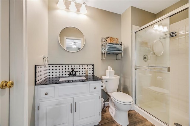 7905 W 129th St, Overland Park, KS 66213 - full bath with toilet, a stall shower, vanity, and wood finished floors