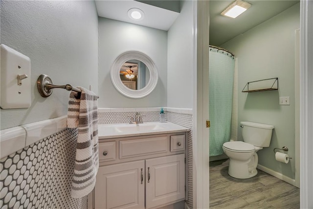 7905 W 129th St, Overland Park, KS 66213 - bathroom with toilet, wood finished floors, and vanity