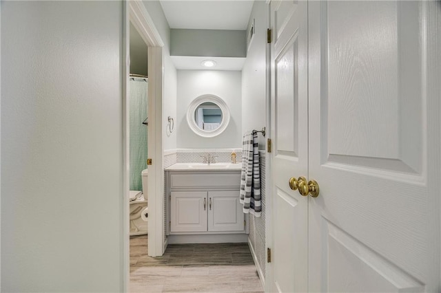 7905 W 129th St, Overland Park, KS 66213 - bathroom featuring vanity, toilet, wood finished floors, and curtained shower