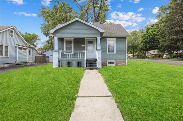 2100 S Scott Ave, Independence, MO 64052 - view of front of property with covered porch and roof with shingles