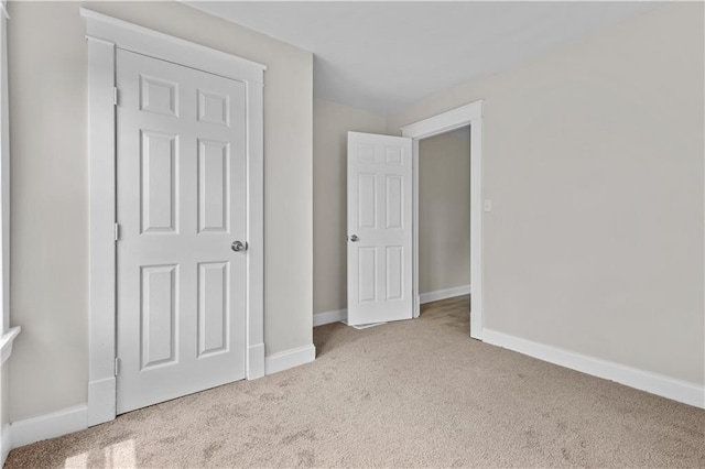 2100 S Scott Ave, Independence, MO 64052 - unfurnished bedroom featuring carpet and baseboards