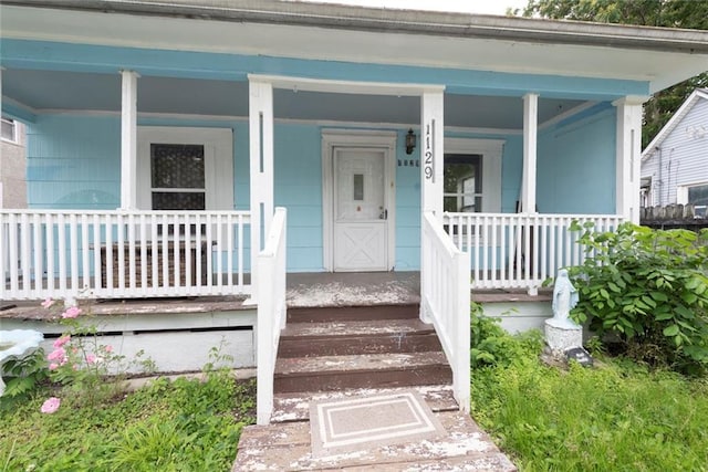 1129 Metropolitan Ave, Kansas City, KS 66103 - doorway to property featuring a porch