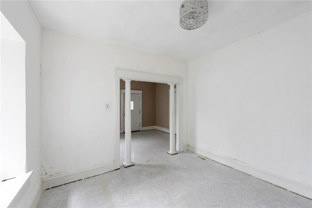 1129 Metropolitan Ave, Kansas City, KS 66103 - unfurnished room with decorative columns and baseboards