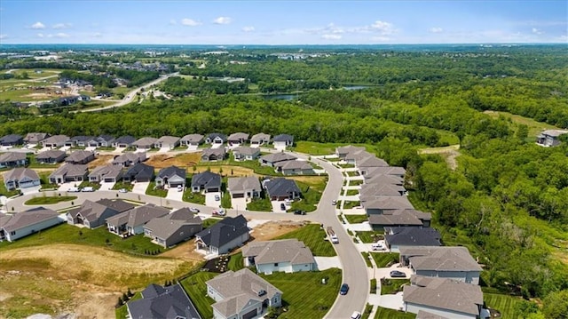9412 Aurora St, Lenexa, KS 66220 - aerial overview of property's location featuring nearby suburban area and a heavily wooded area