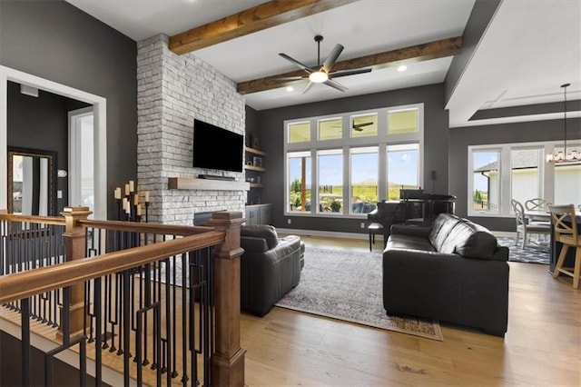 9412 Aurora St, Lenexa, KS 66220 - living area featuring ceiling fan, wood finished floors, beamed ceiling, a fireplace, and recessed lighting